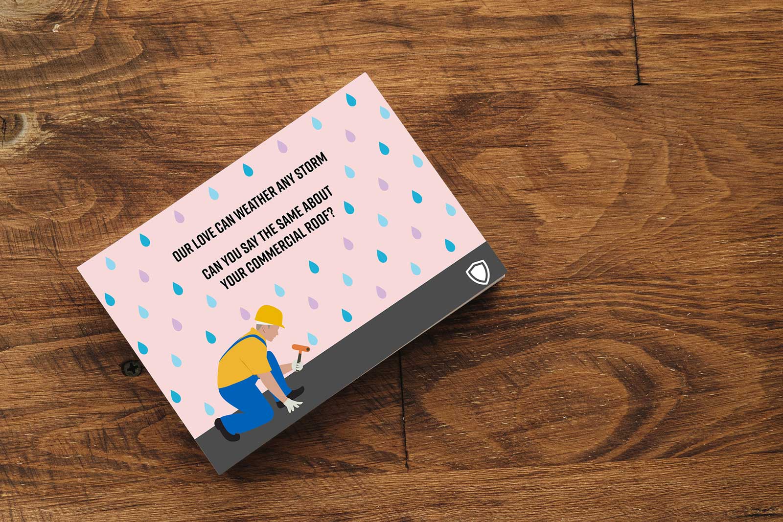 Valentine's Day card featuring raindrops and a construction worker with the following message: "Our love can weather any storm. Can you say the same about your commercial roof?"